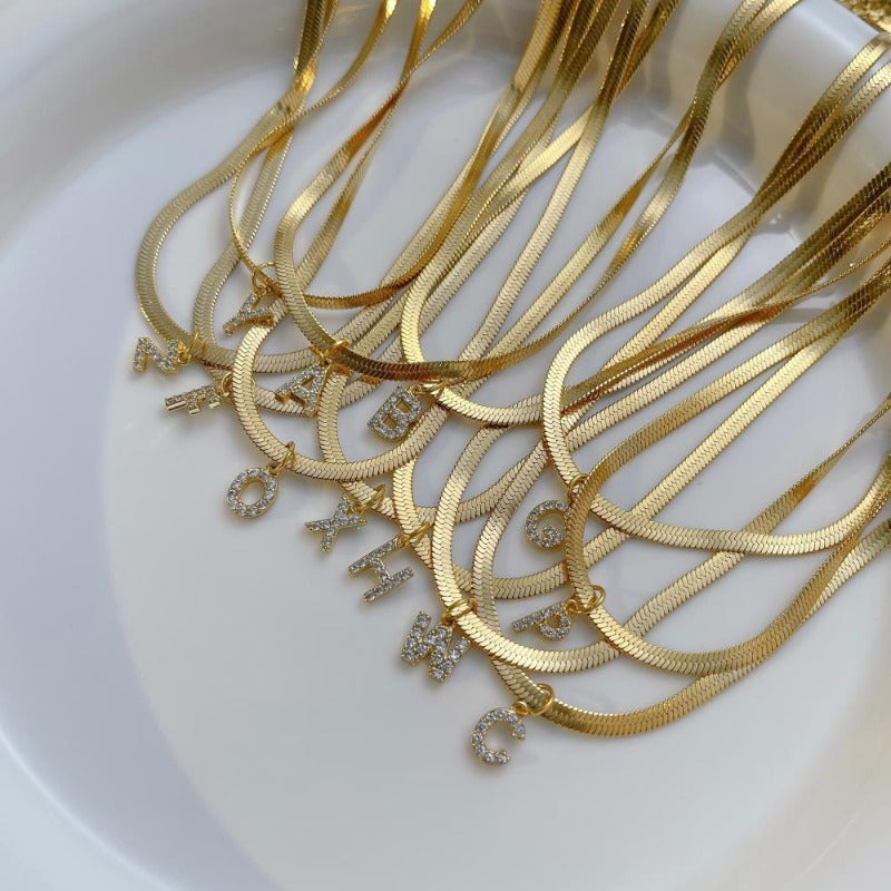 Wholesale French Retro Palace Style Flat Snake Bone Stacking Diamond 26 Letter Titanium Steel Clavicle Chain Necklace